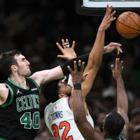 BOSTON, MASSACHUSETTS - MAY 14: Luke Kornet #40 of the Boston Celtics blocks a shot by Karl-Anthony Towns #32 of the New York Knicks during the second half of Game Five of the Eastern Conference Second Round NBA Playoffs at the TD Garden on May 14, 2025 in Boston, Massachusetts. NOTE TO USER: User expressly acknowledges and agrees that, by downloading and or using this photograph, User is consenting to the terms and conditions of the Getty Images License Agreement. (Photo by Brian Fluharty/Getty Images)