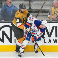 May 14, 2025; Las Vegas, Nevada, USA; Vegas Golden Knights defenseman Noah Hanifin (15) checks Edmonton Oilers center Ryan Nugent-Hopkins (93) during the third period of game five of the second round of the 2025 Stanley Cup Playoffs at T-Mobile Arena. Mandatory Credit: Stephen R. Sylvanie-Imagn Images